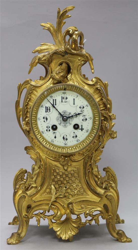 A French Louis XV ormolu clock with dolphin design